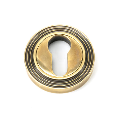 From The Anvil's Aged Brass Round Euro Escutcheon; #finish_aged-brass