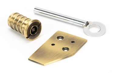 From The Anvil's Aged Brass Key-Flush Sash Stop; #finish_aged-brass