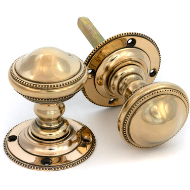 From The Anvil's Aged Brass Brockworth Mortice Knob Set; #finish_aged-brass