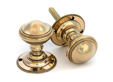 From The Anvil's Aged Brass Brockworth Mortice Knob Set; #finish_aged-brass