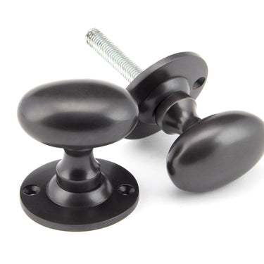 From The Anvil's Aged Bronze Oval Mortice/Rim Knob Set; #finish_aged-bronze