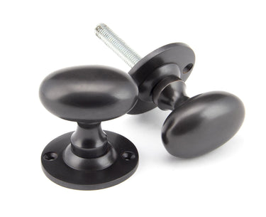 From The Anvil's Aged Bronze Oval Mortice/Rim Knob Set; #finish_aged-bronze