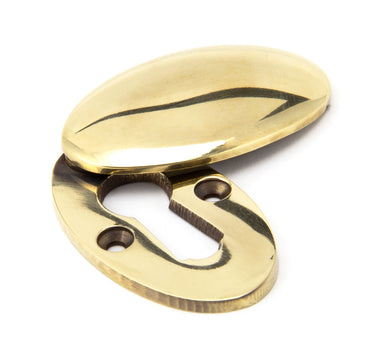 From The Anvil's Aged Brass Oval Escutcheon; #finish_aged-brass