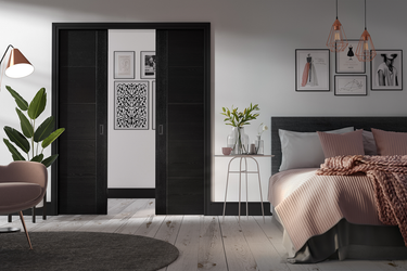 LPD Doors - Flusso Pocket Door Set in modern interior with rich hardwood finish.