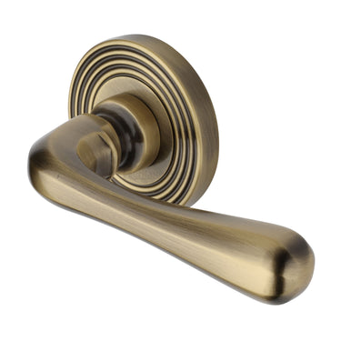 M Marcus - Heritage Brass - Charlbury Door Handles on Round Rose - Reeded - Pair; #finish_antique-brass