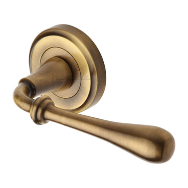 M Marcus - Heritage Brass - Roma Door Handles on Round Rose - Standard - Pair; #finish_antique-brass